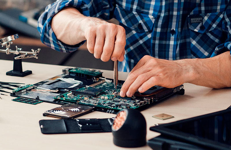 Technician Fixing Motherboard